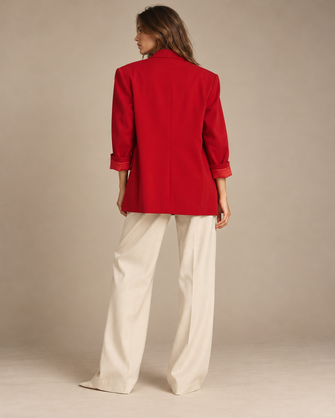 Back view of red oversized blazer with rolled sleeves