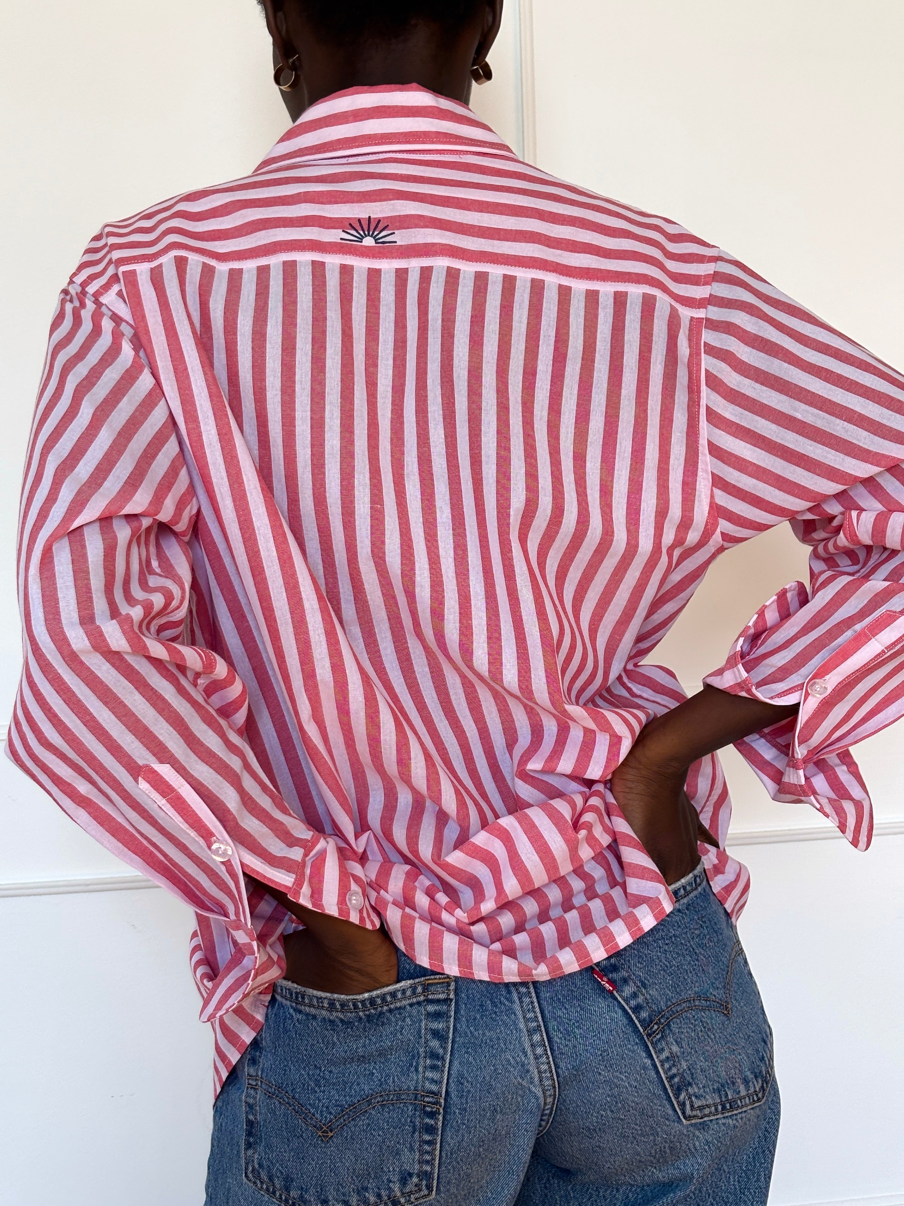 Red and white striped Summer Boxer Boyfriend Shirt with sunset embroidery on back.