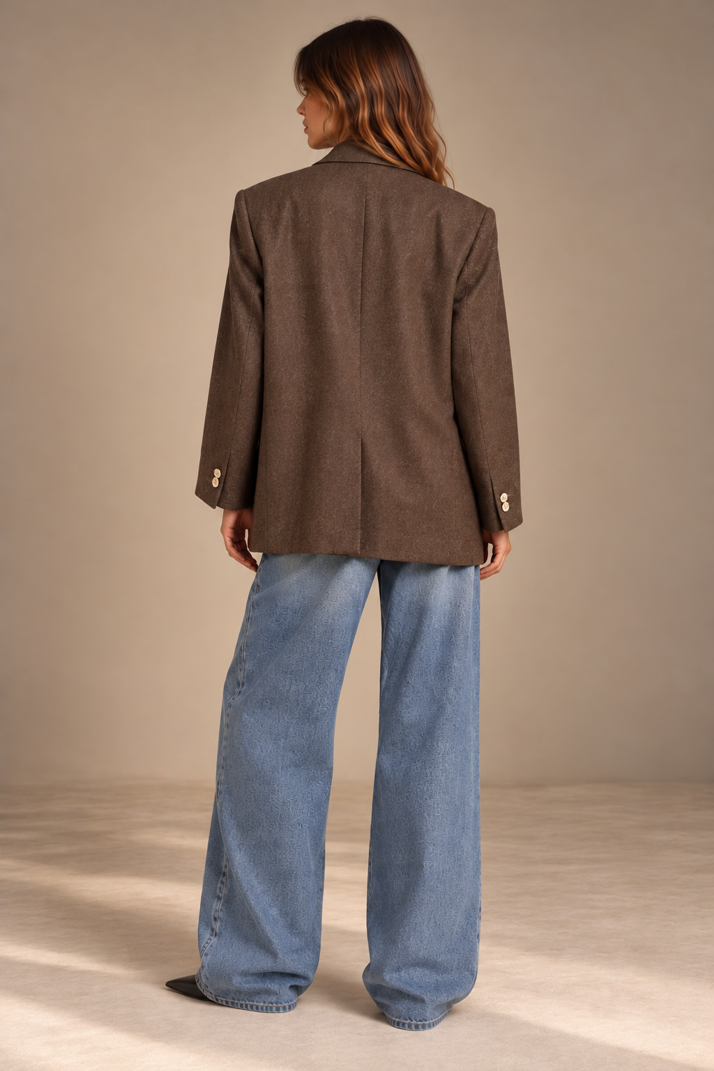Back view of oversized vintage brown wool blazer with centre vent